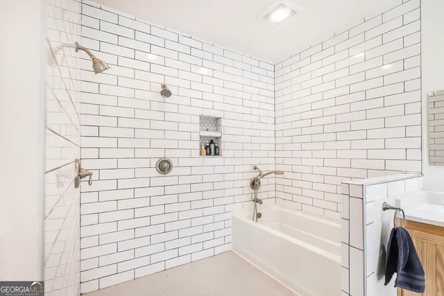 an empty room with windows & cabinet a kitchen view and windows