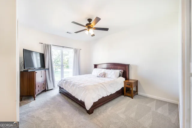 a bathroom with a double vanity sink mirror and toilet