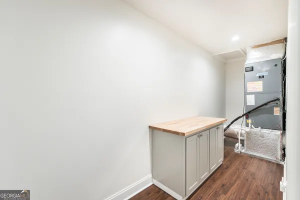 a white toilet sitting next to a bath tub