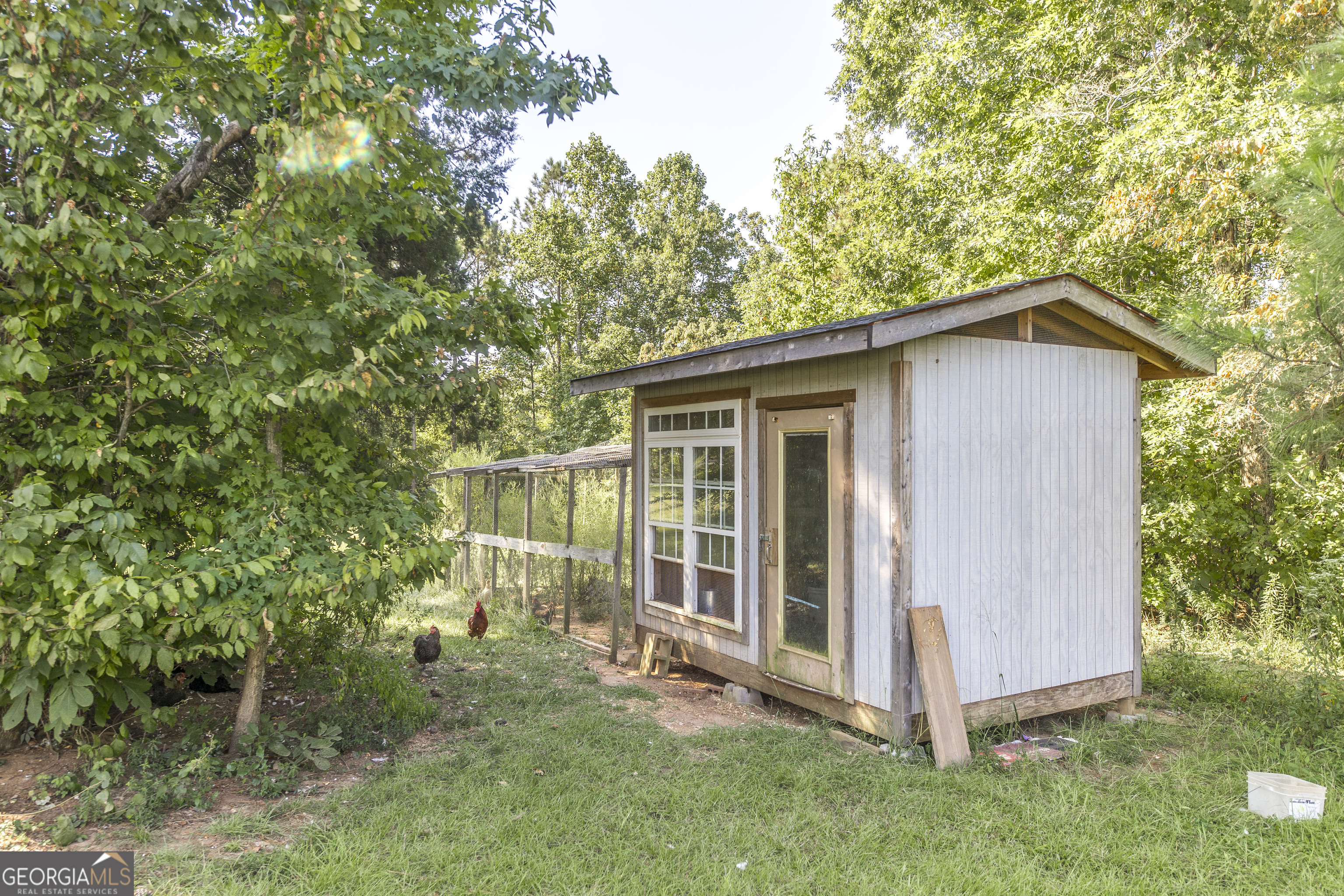 1979 Dent Road Musella, GA 31066 - Photo 69 of 77 a view of a house with a yard and large tree