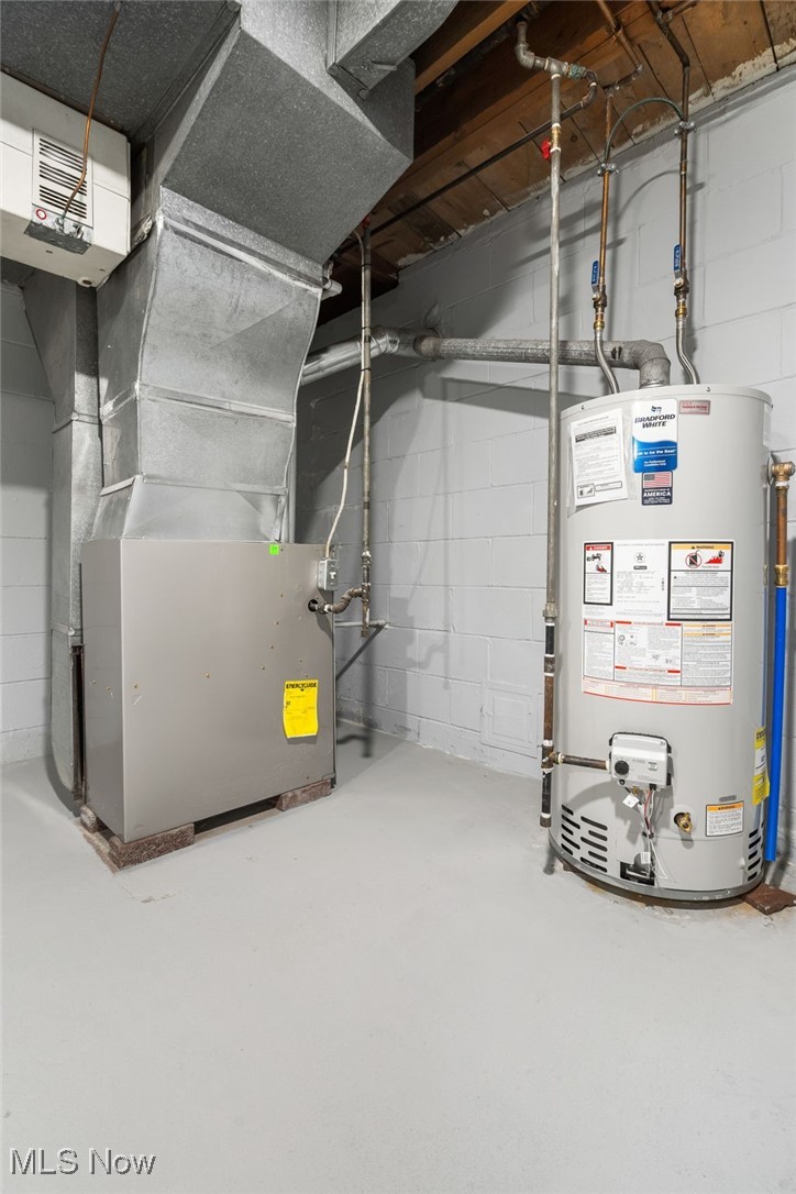 4727 15th Street Northwest Canton, OH 44708 - Photo 30 of 37 Utility room with gas water heater and heating unit