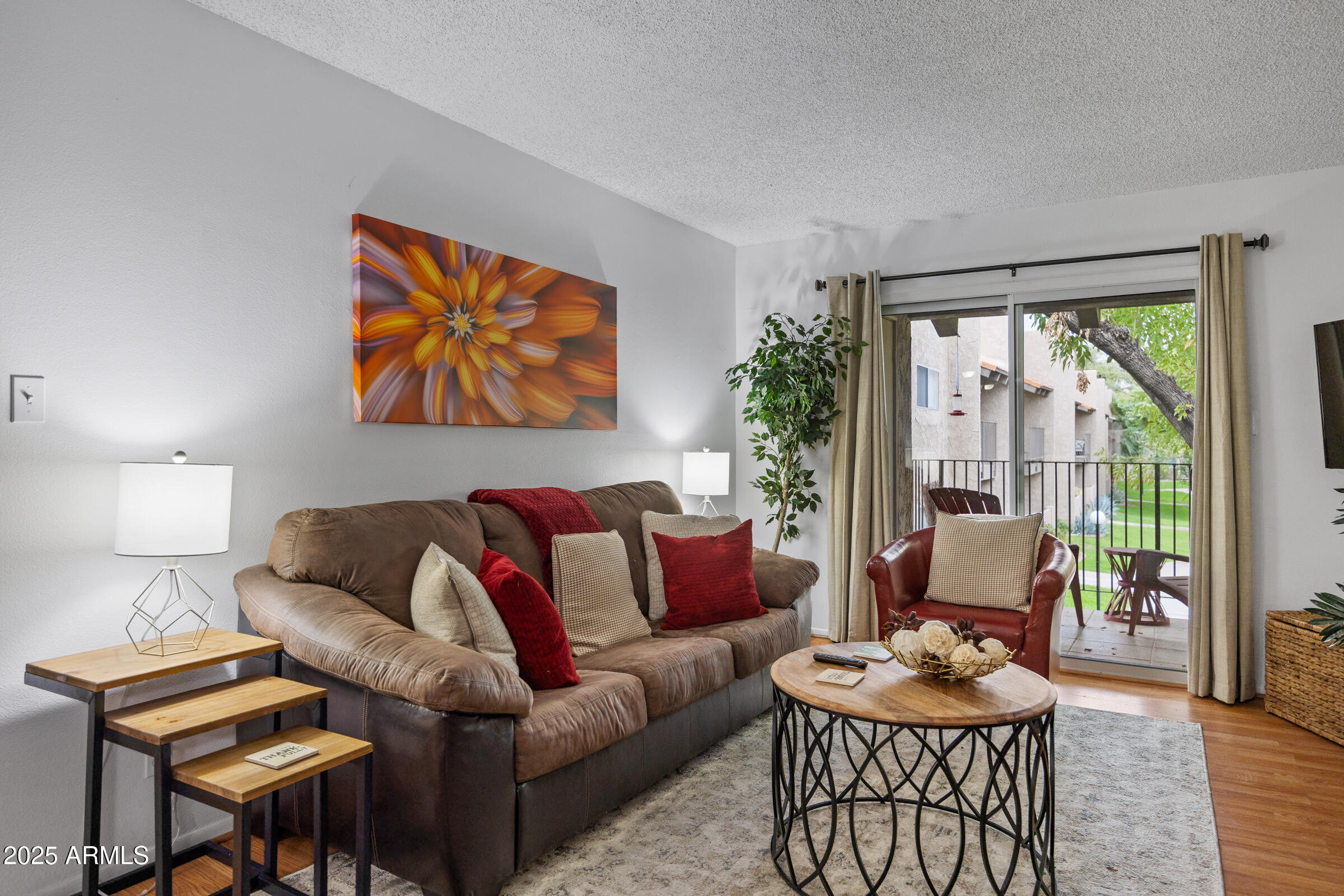 5525 East Thomas Road, Unit M11 Phoenix, AZ 85018 - Photo 15 of 39 a living room with furniture and a large window
