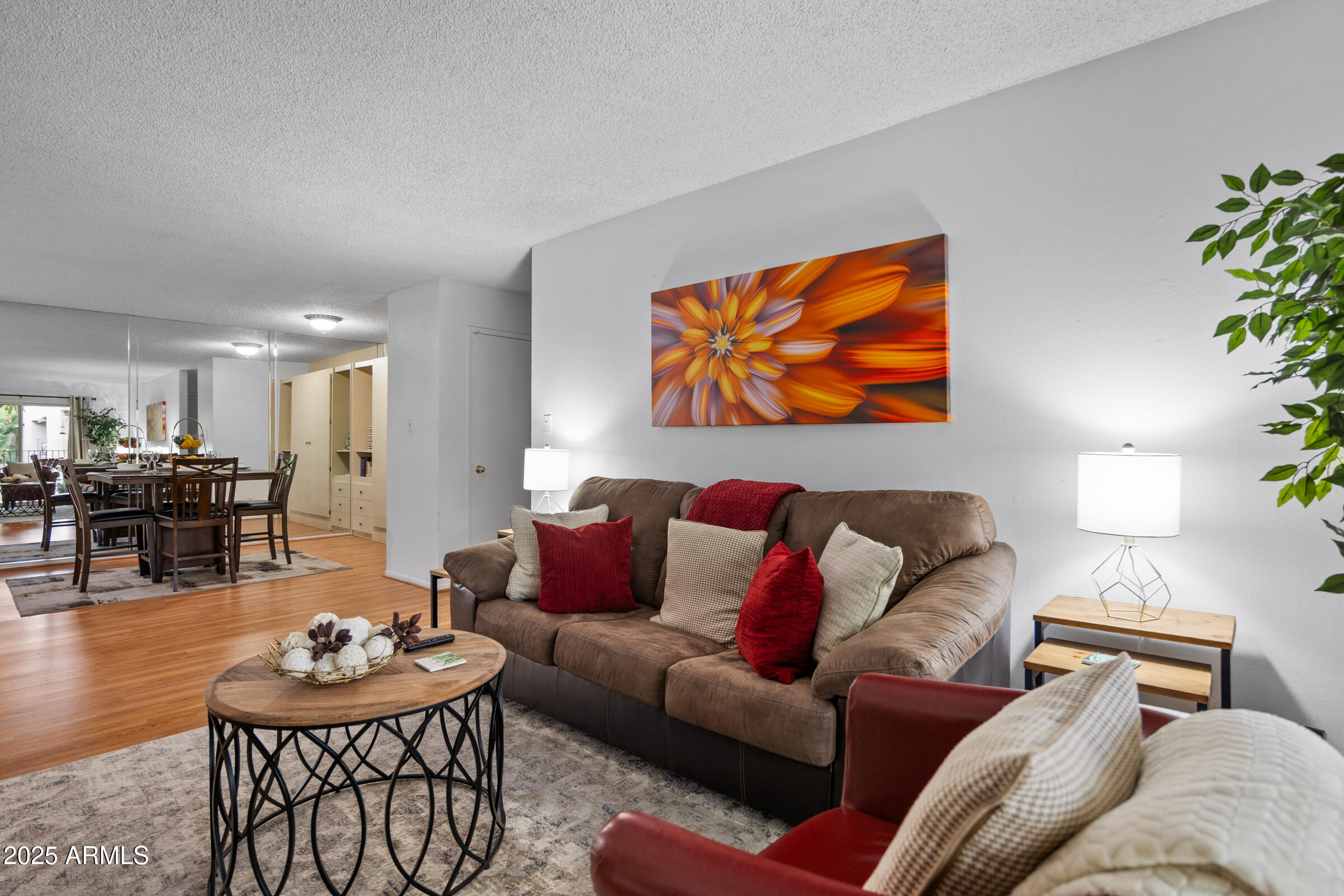 5525 East Thomas Road, Unit M11 Phoenix, AZ 85018 - Photo 16 of 39 a living room with furniture and wooden floor