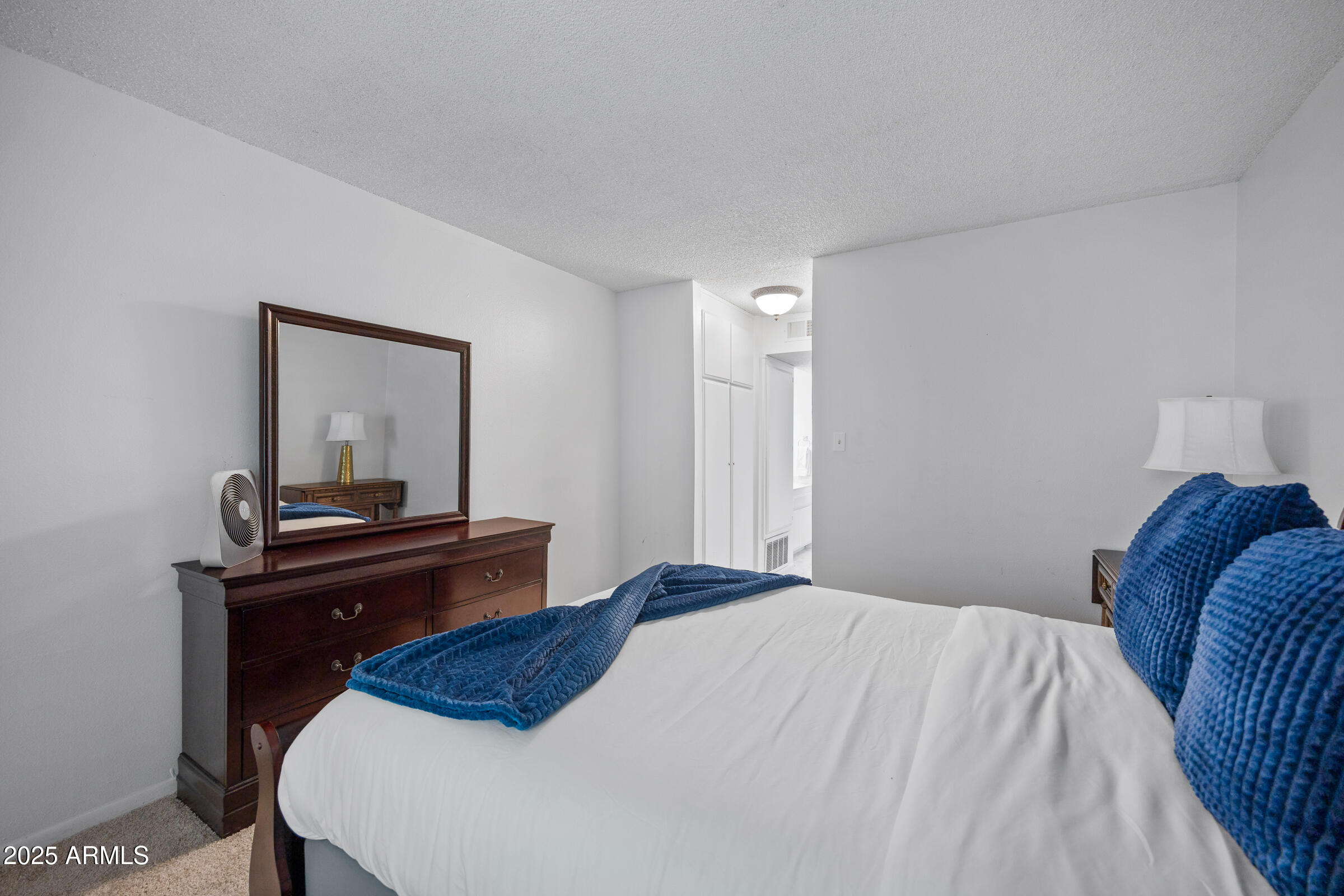 5525 East Thomas Road, Unit M11 Phoenix, AZ 85018 - Photo 19 of 39 a bedroom with a bed and a desk
