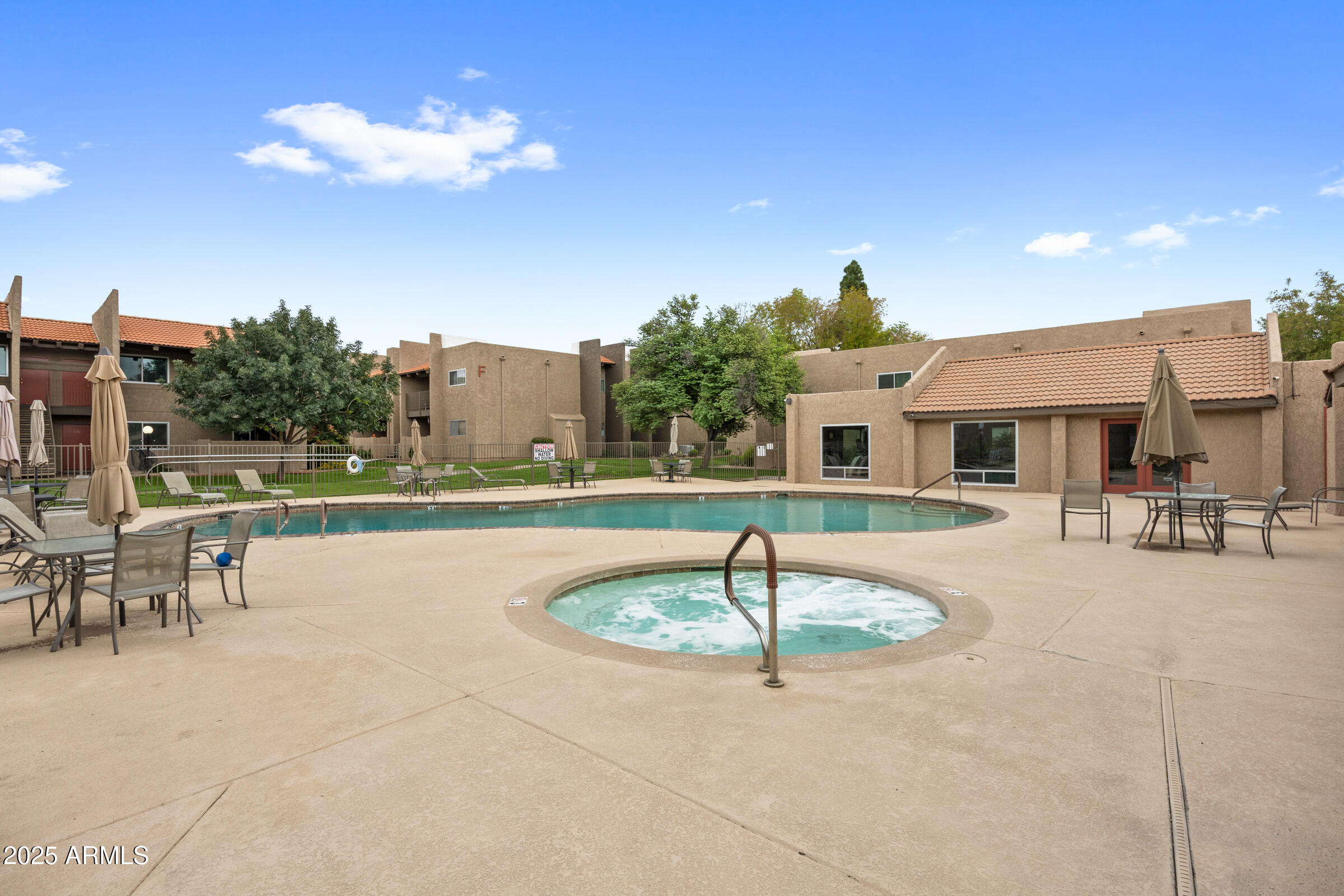 5525 East Thomas Road, Unit M11 Phoenix, AZ 85018 - Photo 24 of 39 a front view of a house with swimming pool having outdoor seating