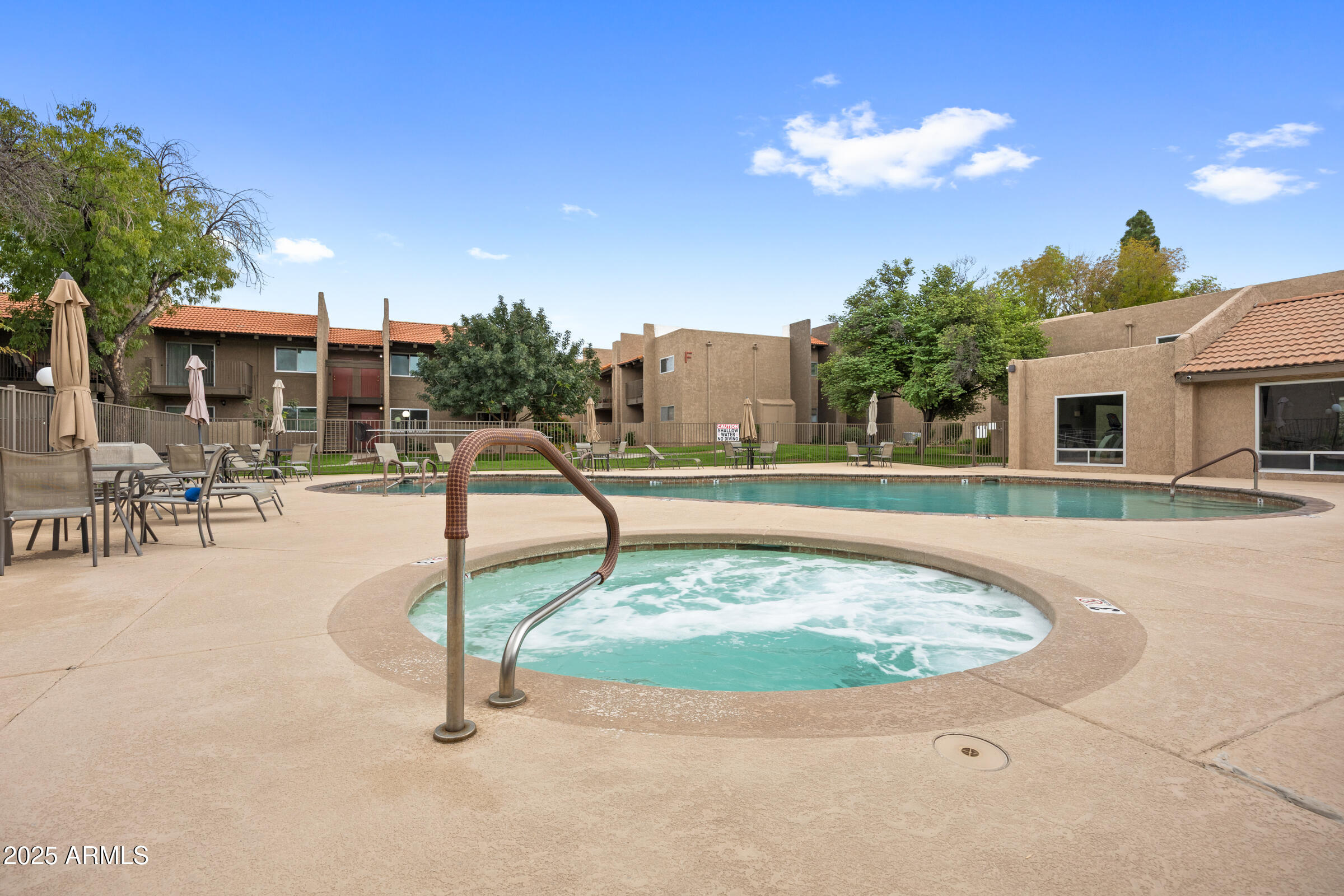 5525 East Thomas Road, Unit M11 Phoenix, AZ 85018 - Photo 25 of 39 a swimming pool with outdoor seating and yard