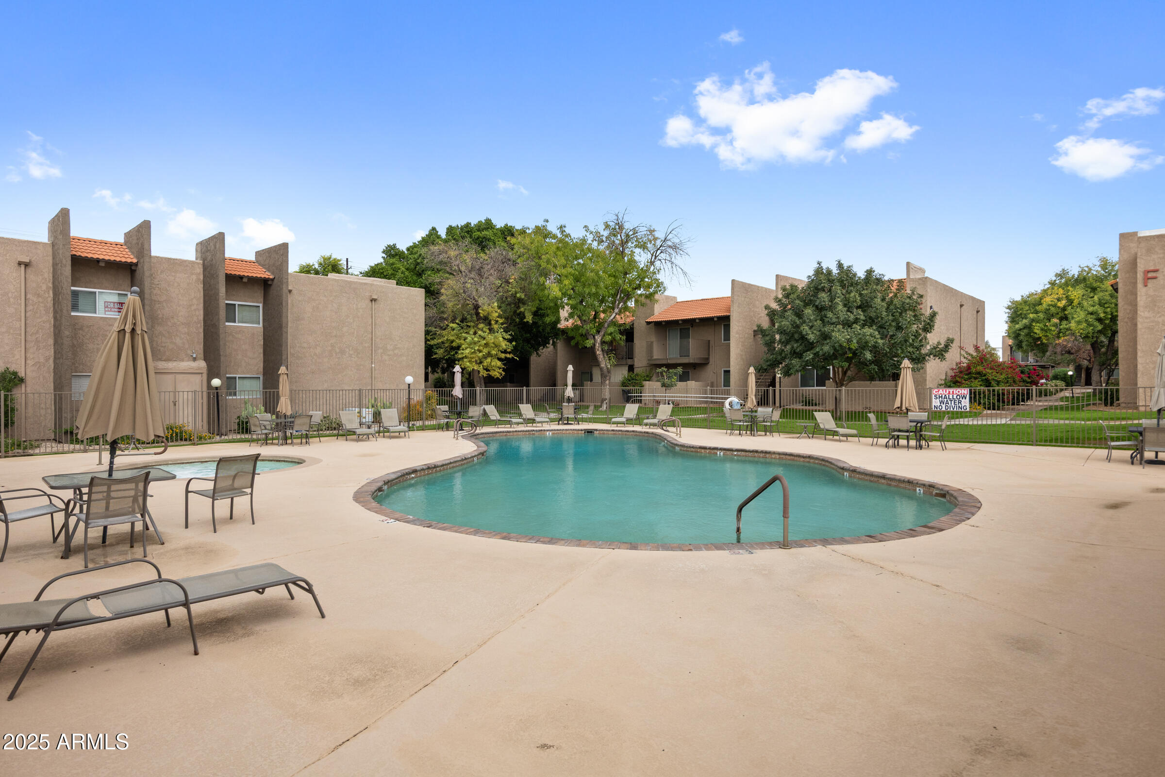 5525 East Thomas Road, Unit M11 Phoenix, AZ 85018 - Photo 27 of 39 a view of a swimming pool with a patio