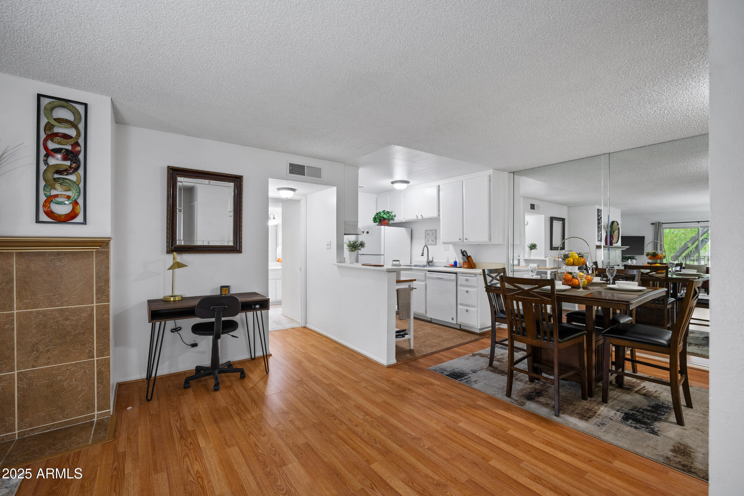 5525 East Thomas Road, Unit M11 Phoenix, AZ 85018 - Photo 2 of 39 a view of a dining room with furniture and wooden floor