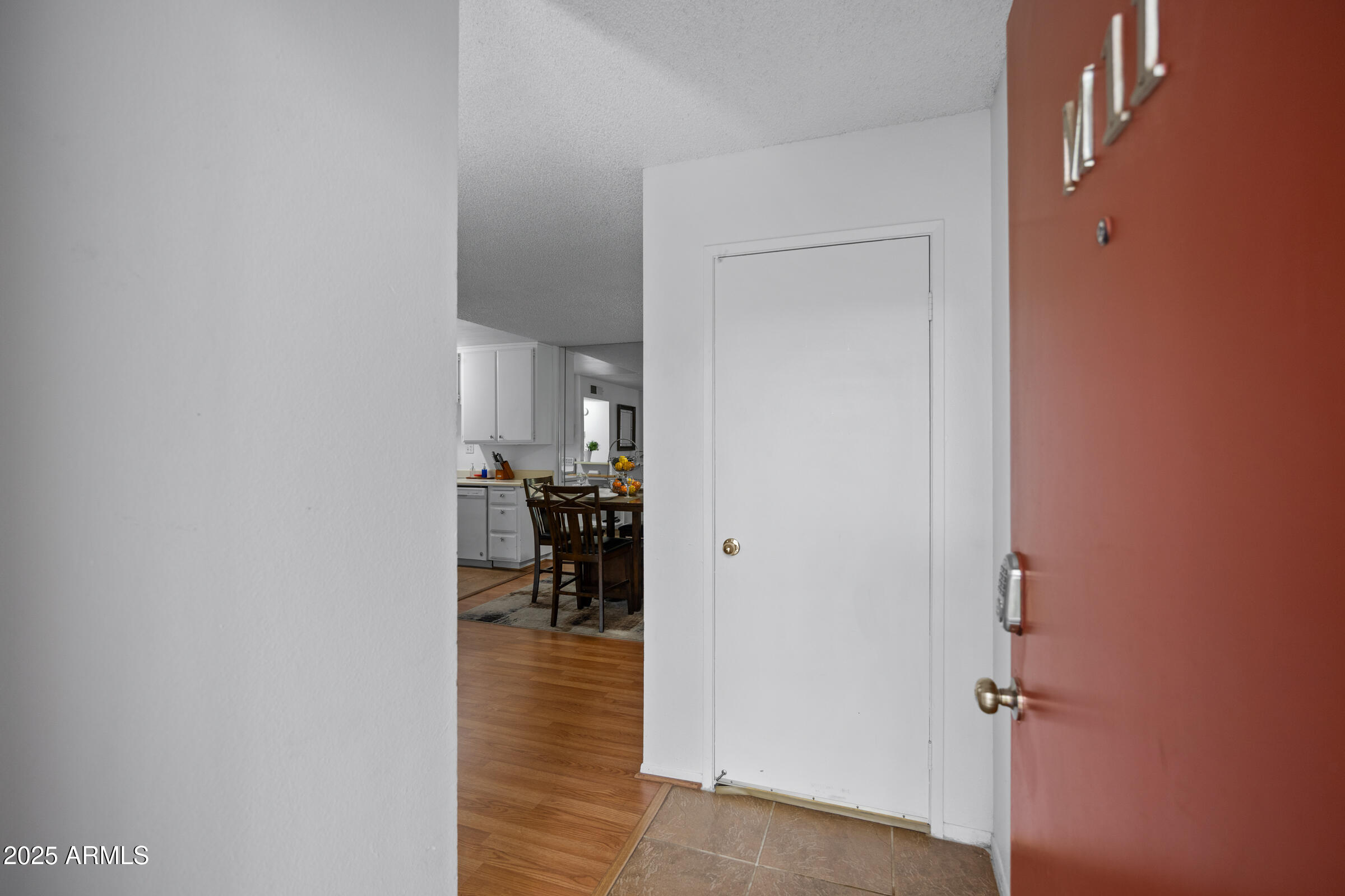 5525 East Thomas Road, Unit M11 Phoenix, AZ 85018 - Photo 35 of 39 a view of a livingroom with furniture and a hallway