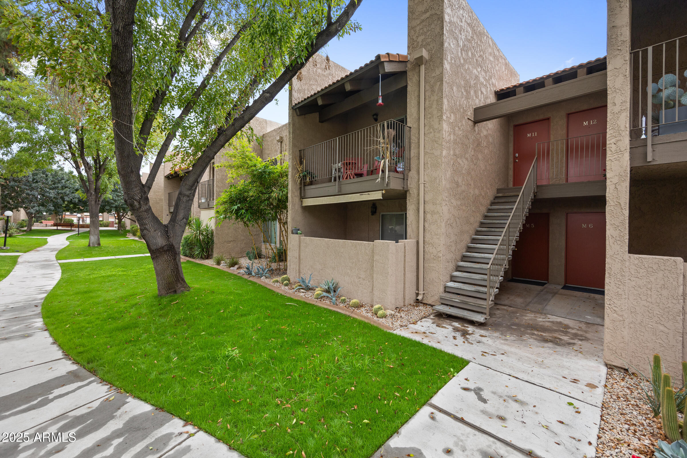5525 East Thomas Road, Unit M11 Phoenix, AZ 85018 - Photo 37 of 39 a view of a house with a yard