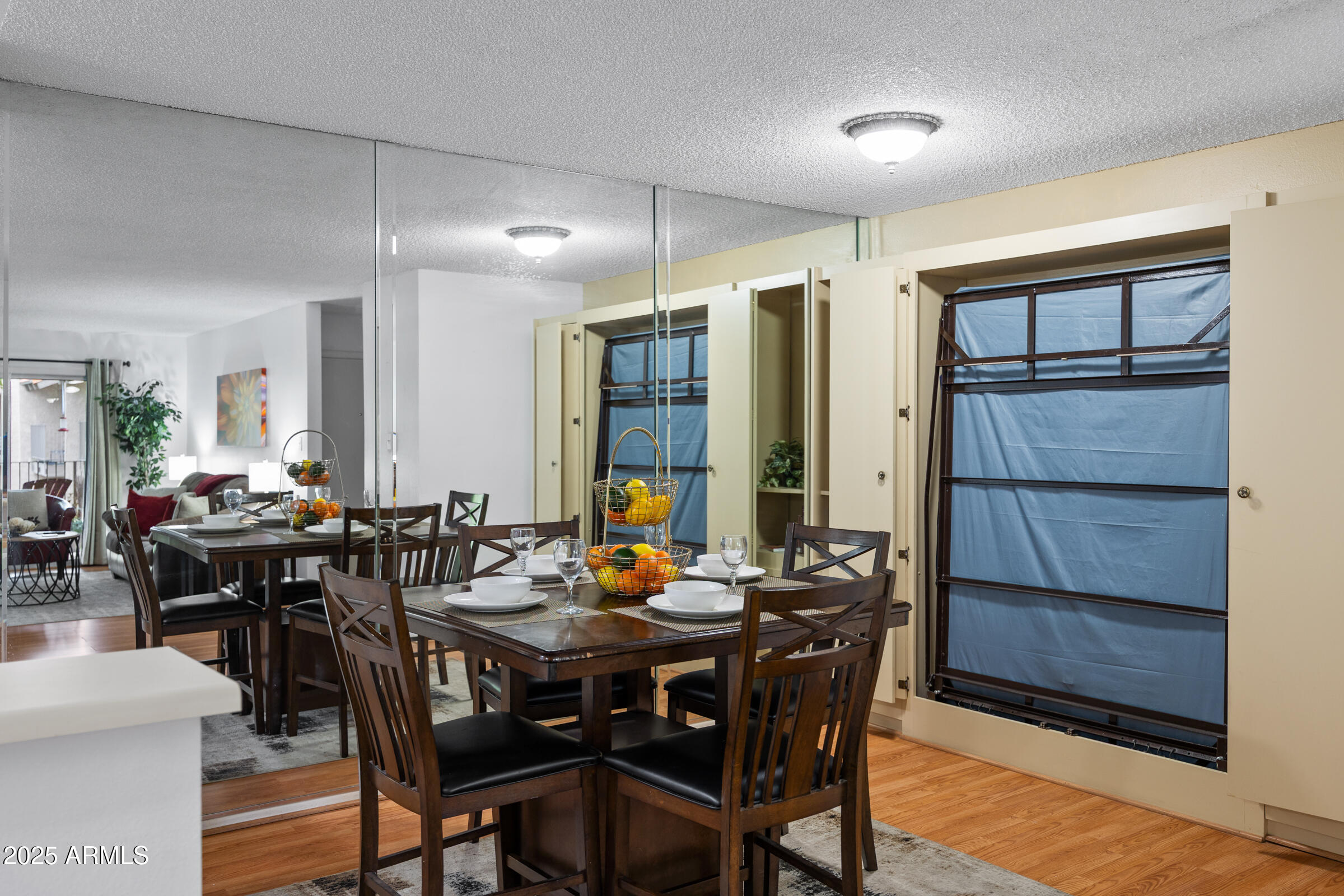5525 East Thomas Road, Unit M11 Phoenix, AZ 85018 - Photo 7 of 39 a view of a dining room with furniture