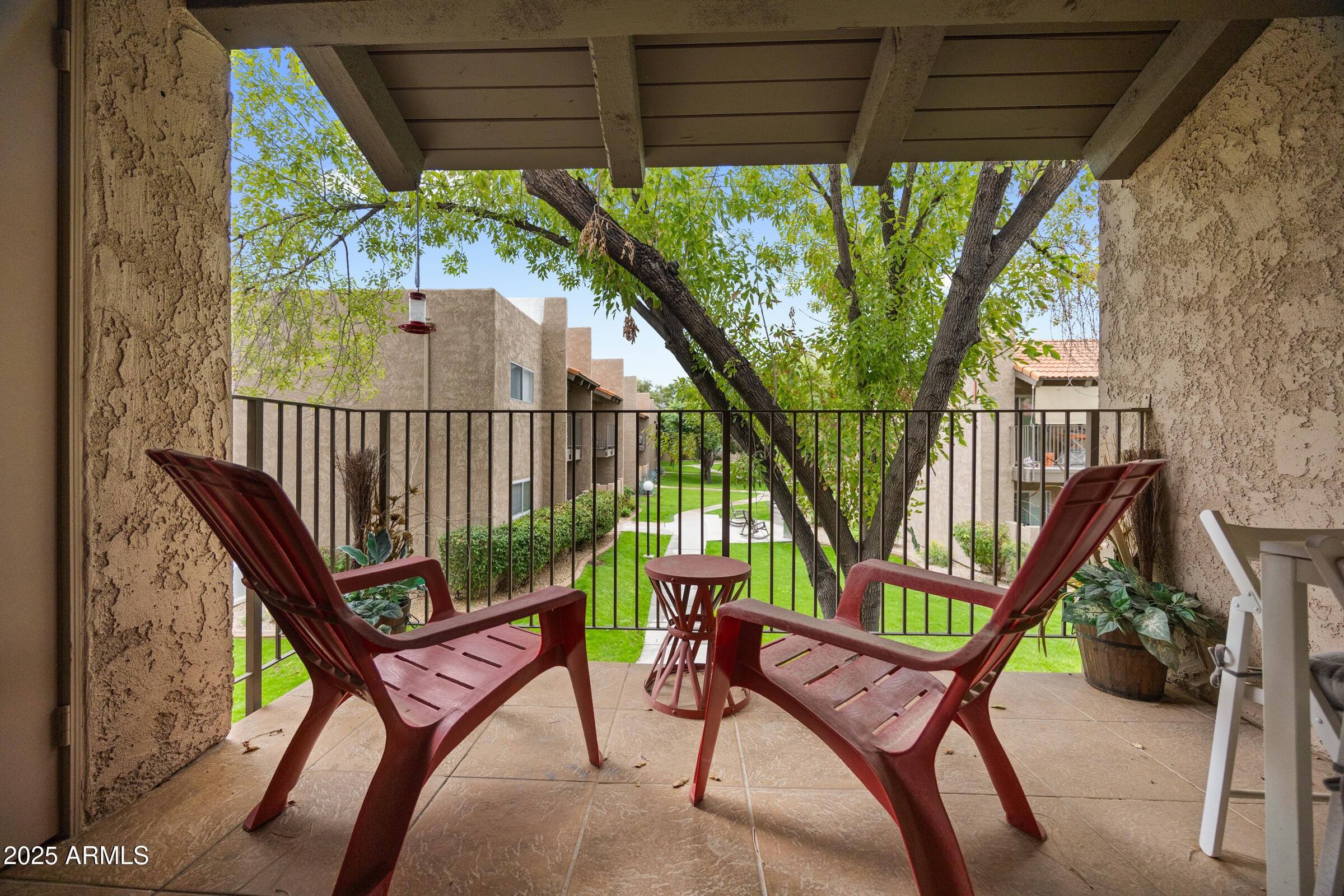 5525 East Thomas Road, Unit M11 Phoenix, AZ 85018 - Photo 9 of 39 a view of a chairs in backyard of the house