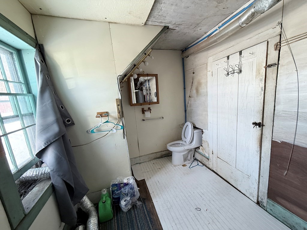 111 High Street Cooperstown, PA 16317 - Photo 11 of 46 a bathroom with a sink mirror vanity and toilet