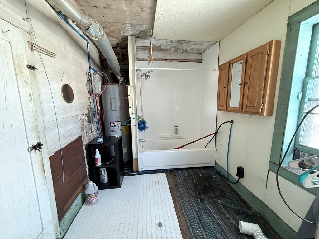 111 High Street Cooperstown, PA 16317 - Photo 12 of 46 a bathroom with a bathtub and a shower