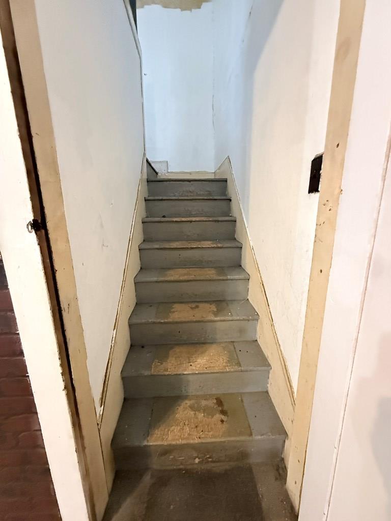111 High Street Cooperstown, PA 16317 - Photo 14 of 46 a view of staircase with white walls and railing