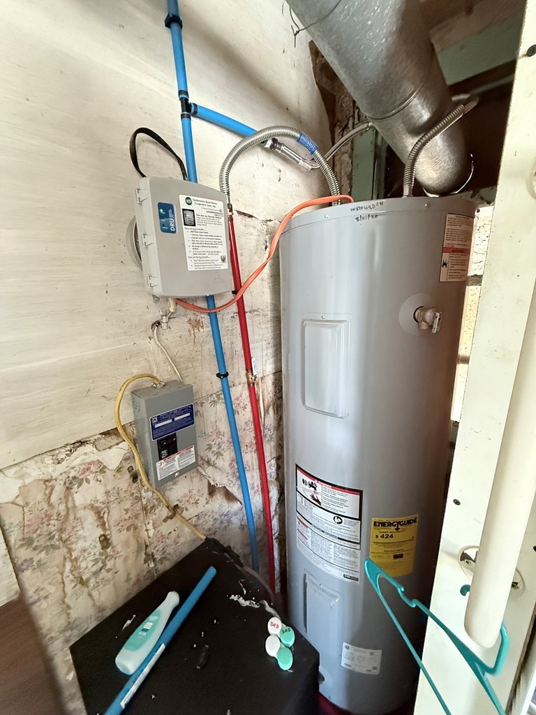 111 High Street Cooperstown, PA 16317 - Photo 36 of 46 a room with water heater and refrigerator