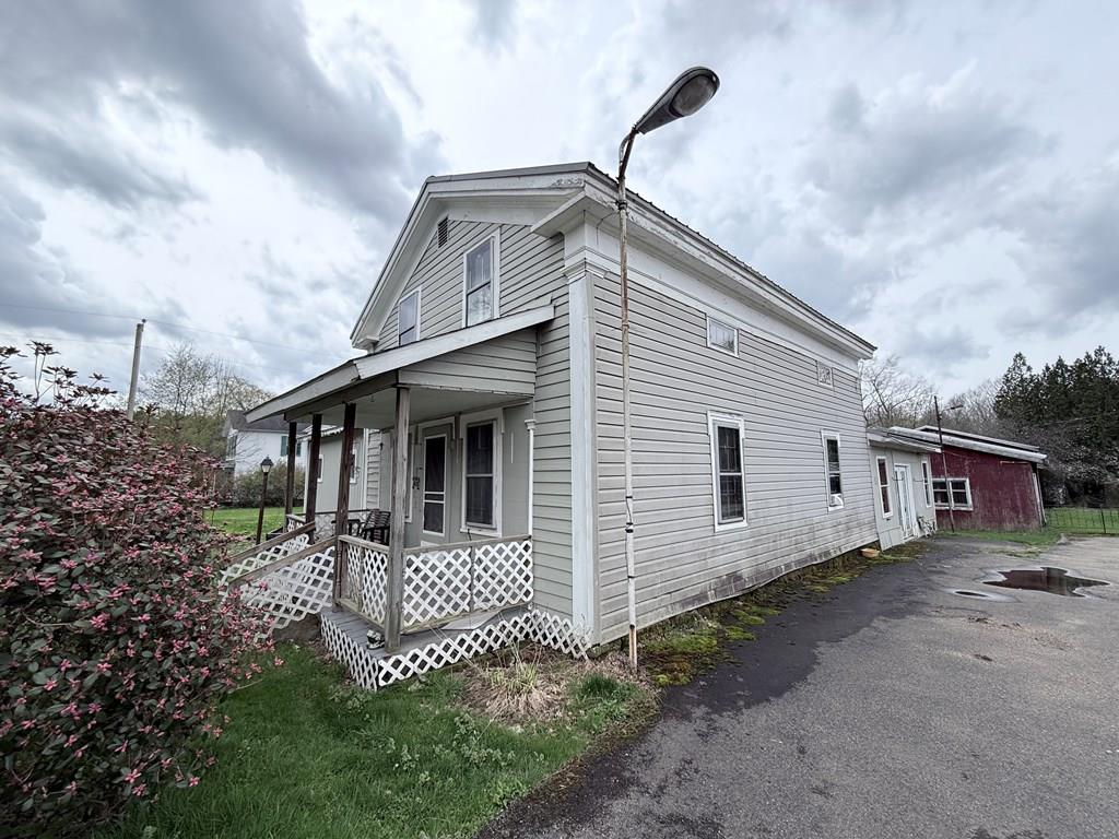 111 High Street Cooperstown, PA 16317 - Photo 40 of 46 a view of a house with a small yard and wooden fence