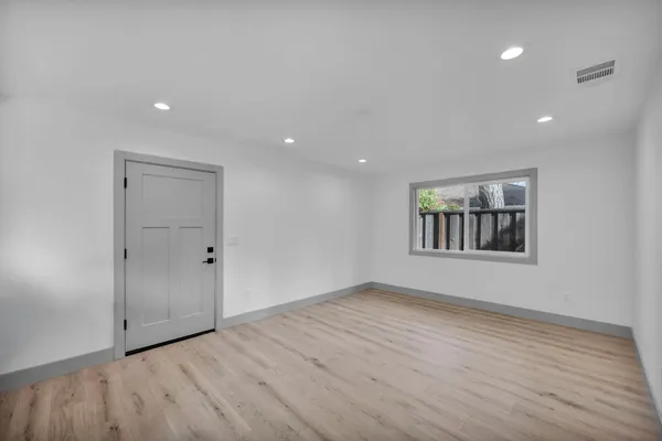 a bathroom with a granite countertop sink toilet and bathtub