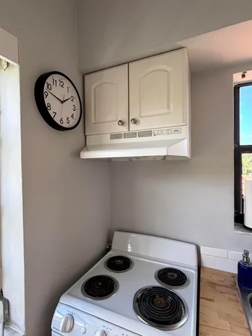 an outdoor space with lounge chair