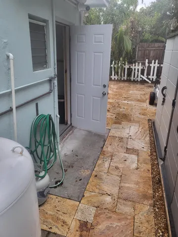 a view of swimming pool with a yard and plants