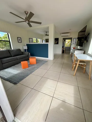 a living room with furniture and a window