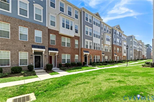 a view of a building with a yard