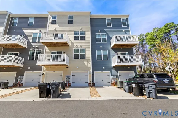 a street view of a building with many windows
