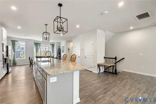 a kitchen with counter space and windows