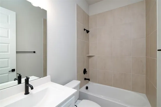 a bathroom with a sink and a bathtub