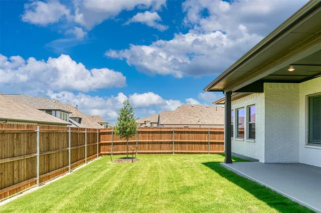 a view of a backyard with lake view
