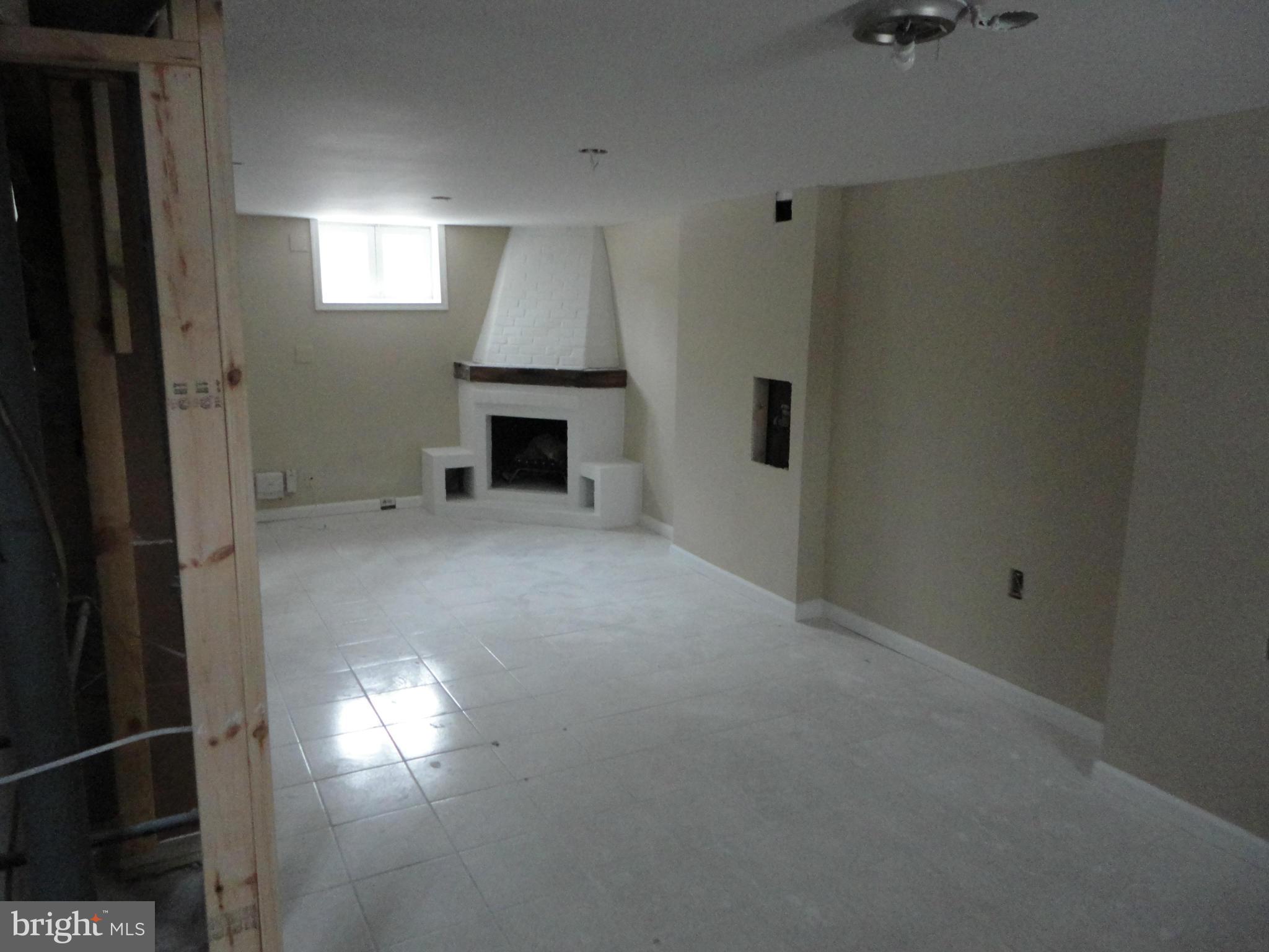 11509 Joseph Mill Road Silver Spring, MD 20906 - Photo 5 of 24 a view of empty room with a fireplace
