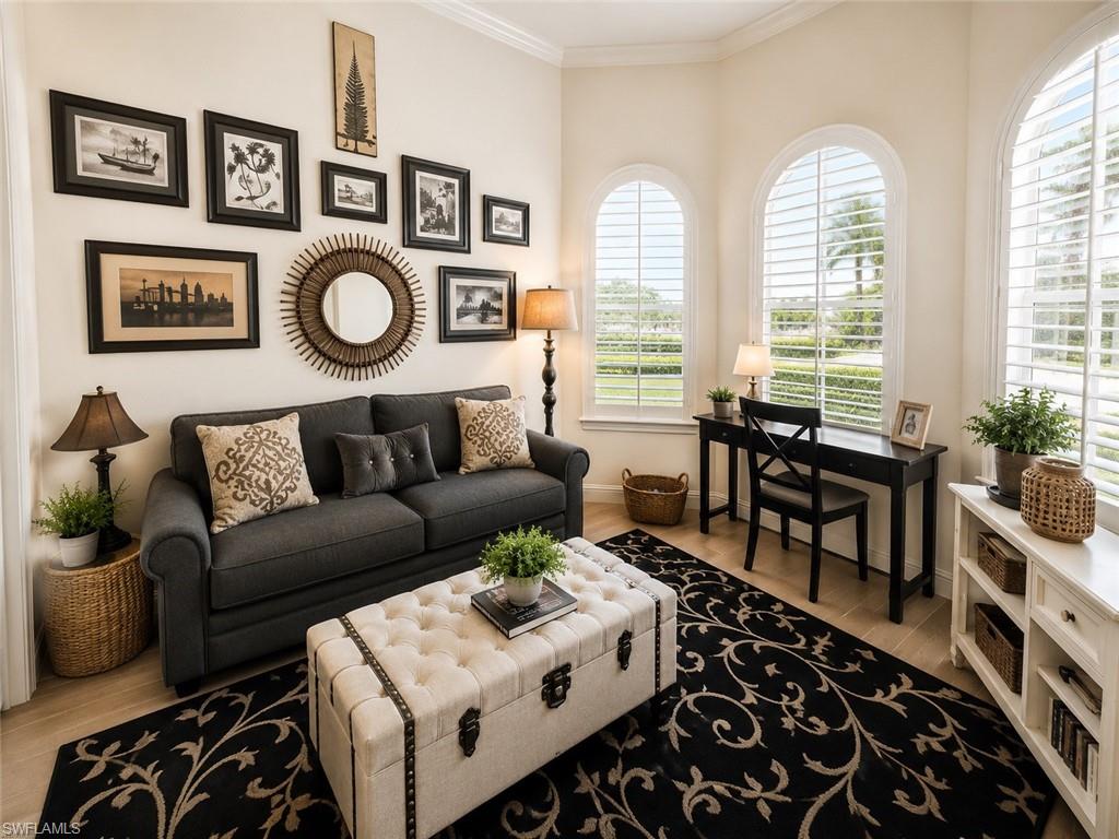 6574 Amarone Lane Naples, FL 34113 - Photo 16 of 44 a living room with furniture and a large window
