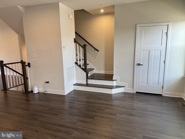 711 Quarry Point Road Malvern, PA 19355 - Photo 3 of 26 a view of empty room with wooden floor and stairs