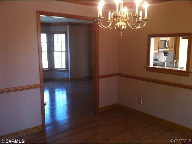 11901 Taplow Road Midlothian, VA 23112 - Photo 6 of 7 a view of empty room with wooden floor and fan