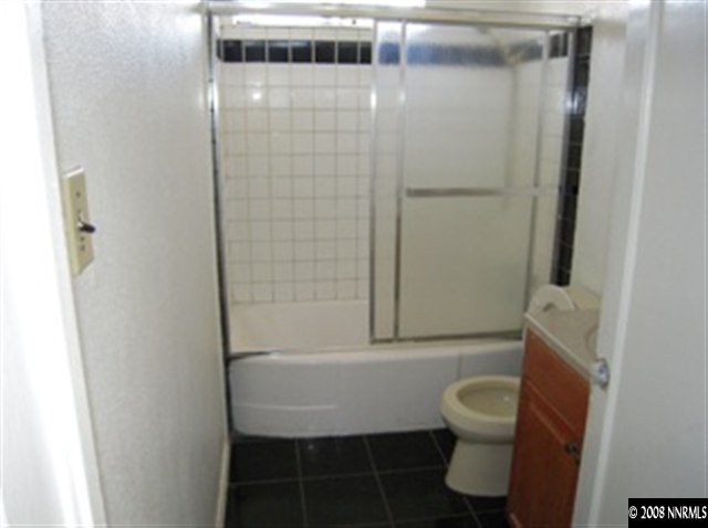 595 Apple Street Reno, NV 89502 - Photo 6 of 9 a bathroom with a toilet and shower