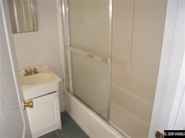 595 Apple Street Reno, NV 89502 - Photo 7 of 9 a bathroom with a sink and vanity