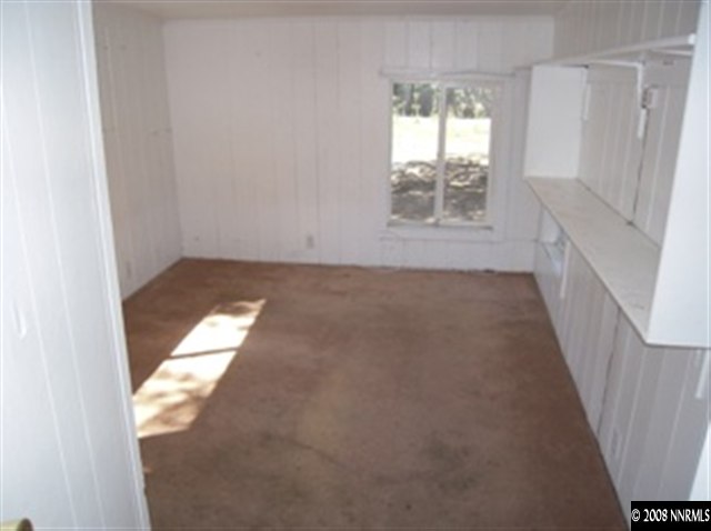 595 Apple Street Reno, NV 89502 - Photo 8 of 9 a view of an empty room and a window
