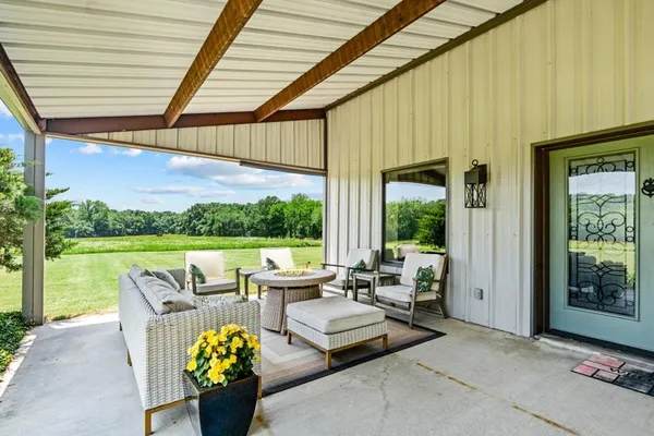 a outdoor living space with furniture and garden view