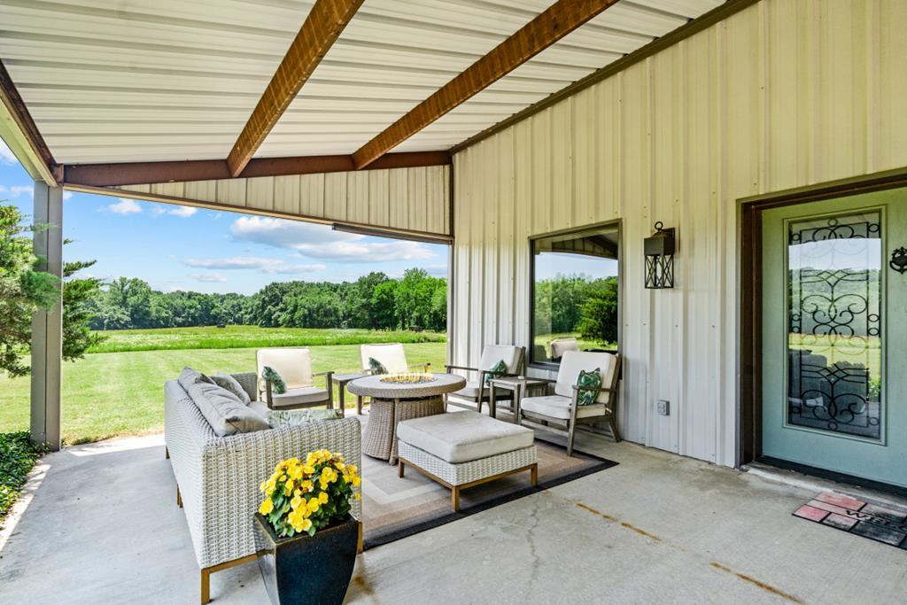 455 County Road 2808 Mabank, TX 75147 - Photo 11 of 40 a outdoor living space with furniture and garden view