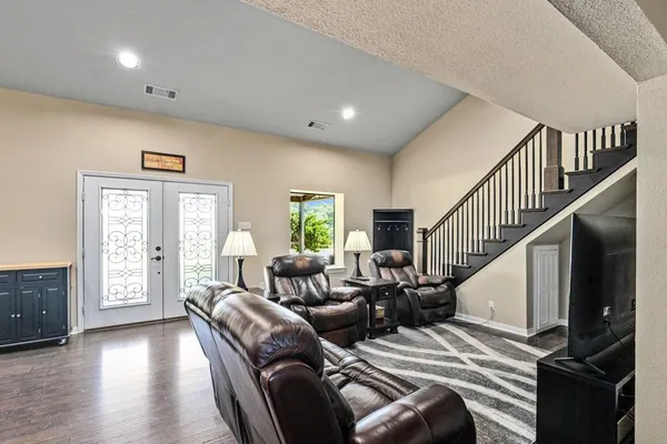 a living room with furniture and a window
