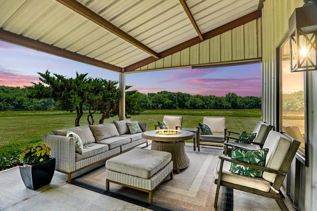 455 County Road 2808 Mabank, TX 75147 - Photo 2 of 40 a balcony with furniture and garden view