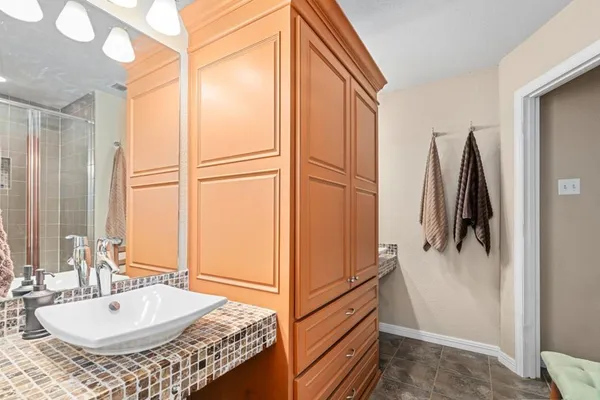 a bathroom with a tub and a sink
