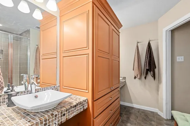a bathroom with a tub and a sink