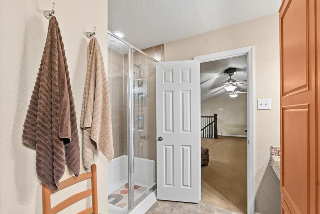 455 County Road 2808 Mabank, TX 75147 - Photo 27 of 40 a view of walk in closet with clothes and shoes
