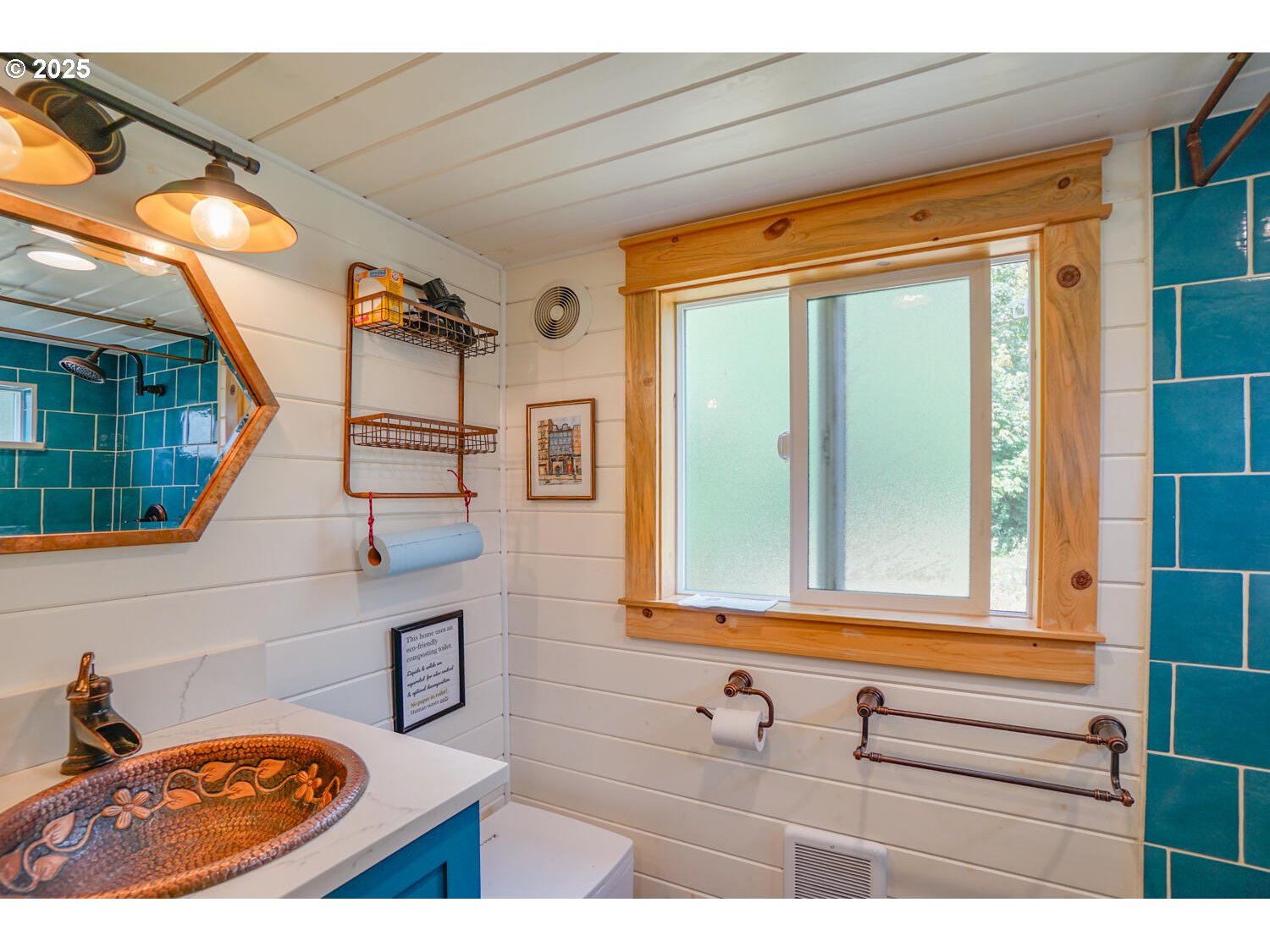 1922 Duncan Creek Road Stevenson, WA 98648 - Photo 19 of 39 a bathroom with a sink a mirror and next to a window