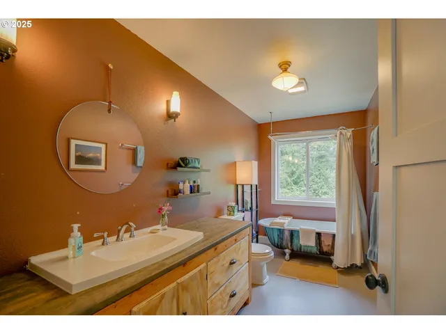 a bathroom with a sink mirror and a bathtub