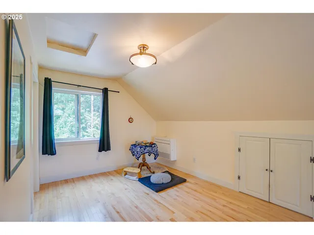 a view of a room with window and wooden floor