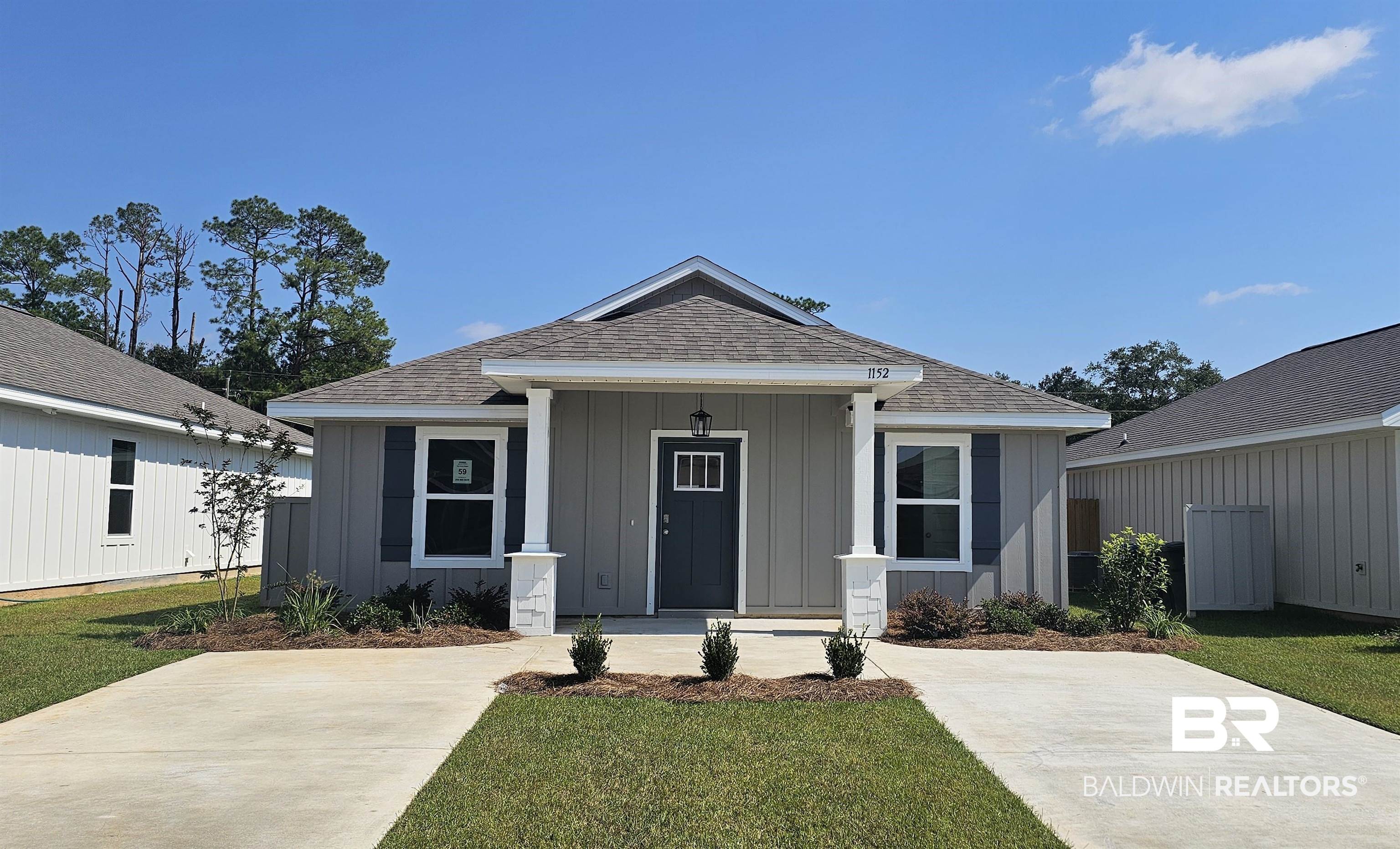1152 Sweet Laurel Street Foley, AL 36535 - Photo 1 of 4 View of front of home featuring a front lawn