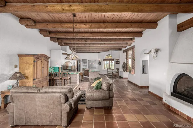 a bathroom with a granite countertop sink a mirror a bathtub and shower