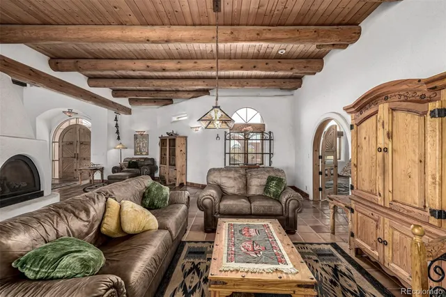 a view of a livingroom with furniture and a window
